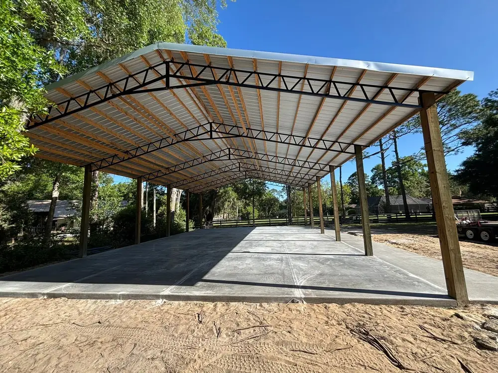 Finished concrete slab under an open timber pavilion