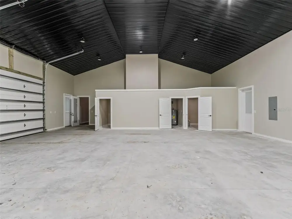 Machine-troweled concrete shop floor inside a metal building