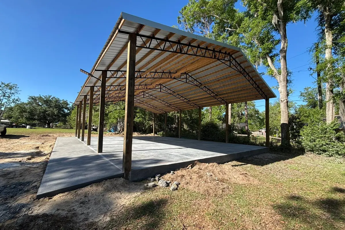 Large concrete slab poured under an open pavilion structure